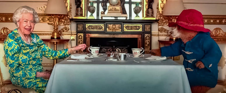 Who is Queen Elizabeth II having tea with in this picture?