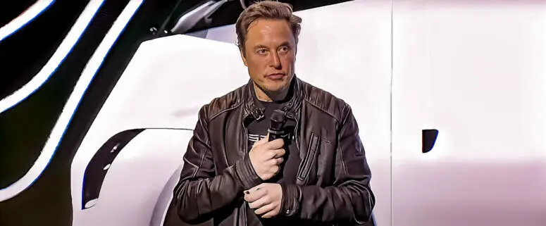 What did Elon Musk do to regain his wealthiest person status in February 2023?