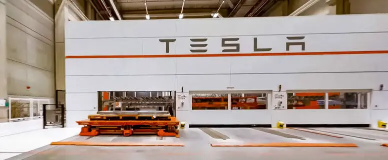 In January 2024, what prompted Tesla to put the brakes on production at its German plant?